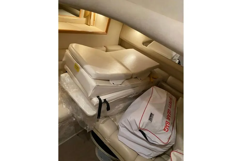  Yacht Photos Pics 1997 Sea Ray Sundancer 400 cabin interior with safety gear bag and cushions.