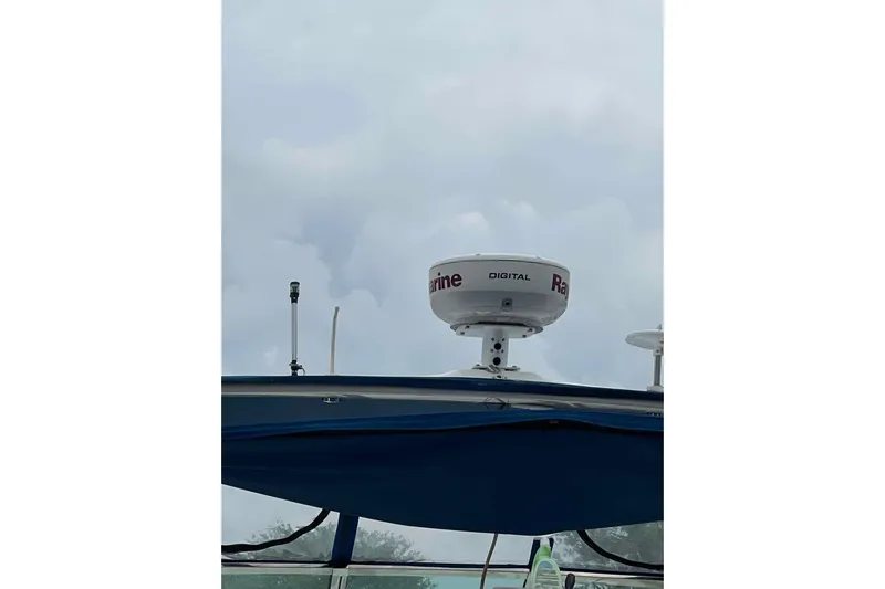  Yacht Photos Pics Radar equipment on a 1997 Sea Ray Sundancer 400 boat under cloudy skies.