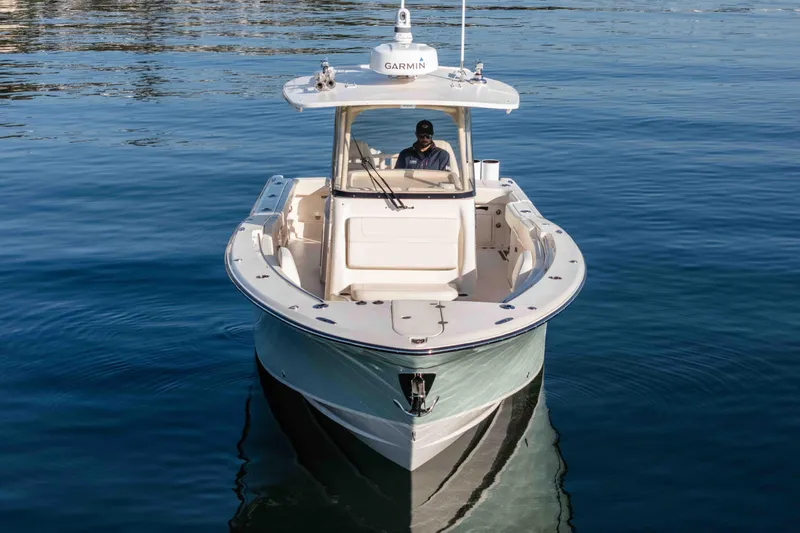  Yacht Photos Pics 2022 Grady-White Canyon 306 boat on calm water, front view.