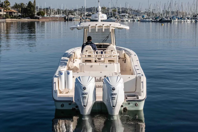  Yacht Photos Pics 2022 Grady-White Canyon 306 boat with dual engines on calm water.