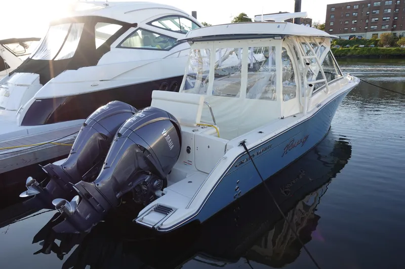  Yacht Photos Pics 2021 Grady-White Freedom 325 boat docked with twin Yamaha outboard engines.