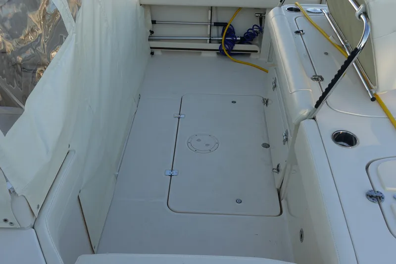  Yacht Photos Pics 2021 Grady-White Freedom 325 boat interior with clean deck and storage compartments.