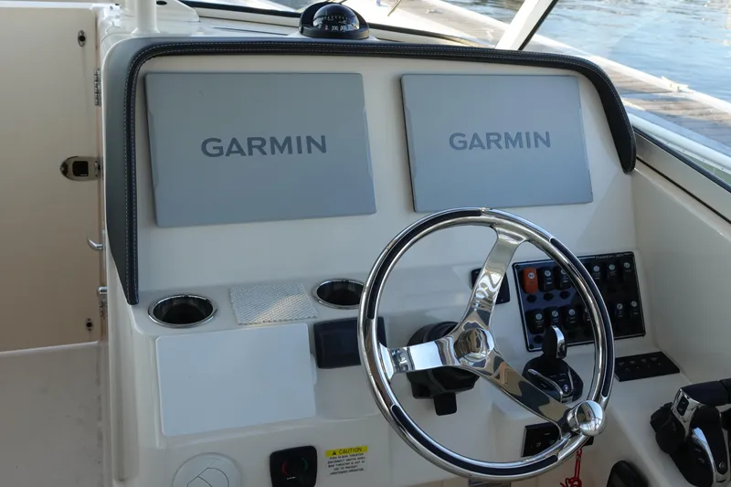  Yacht Photos Pics 2021 Grady-White Freedom 325 helm with dual Garmin displays and steering wheel.