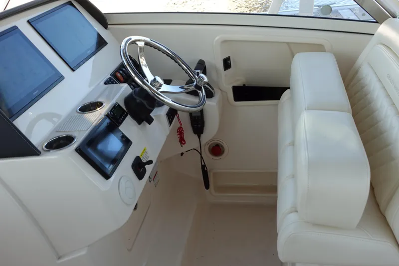  Yacht Photos Pics 2021 Grady-White Freedom 325 helm with modern controls and plush seating.
