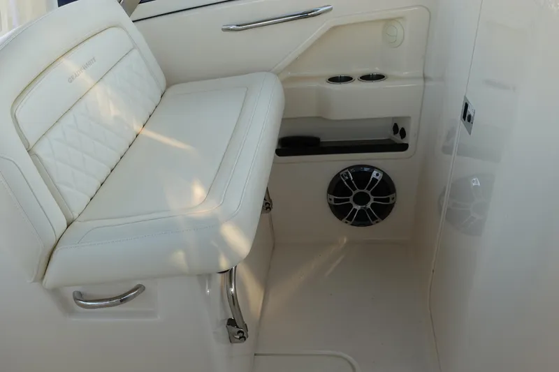  Yacht Photos Pics 2021 Grady-White Freedom 325 interior seating with speaker and cup holders.