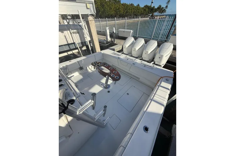 Scott Free Yacht Photos Pics 2024 Contender 44 ST boat with quad engines, spacious deck, and fishing rod holders.