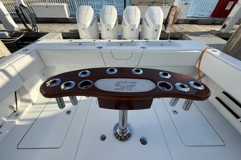Scott Free Yacht Photos Pics 2024 Contender 44 ST boat with rod holders and Mercury engines at dock.
