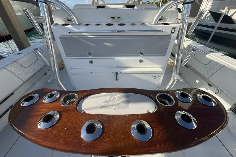 Scott Free Yacht Photos Pics 2024 Contender 44 ST boat interior with rod holders and seating area.