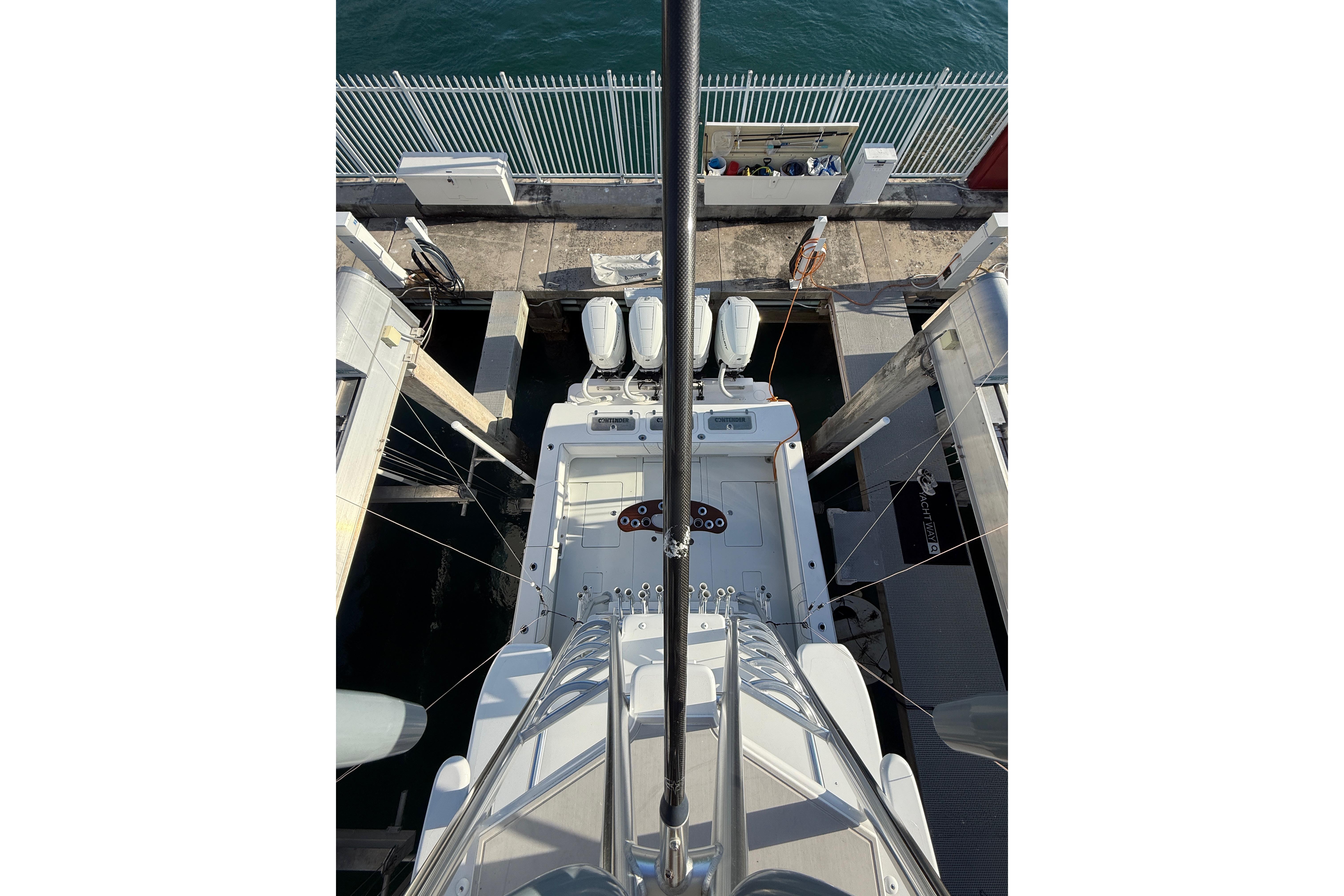 2024 Contender 44 ST boat docked, aerial view showing deck and engines.