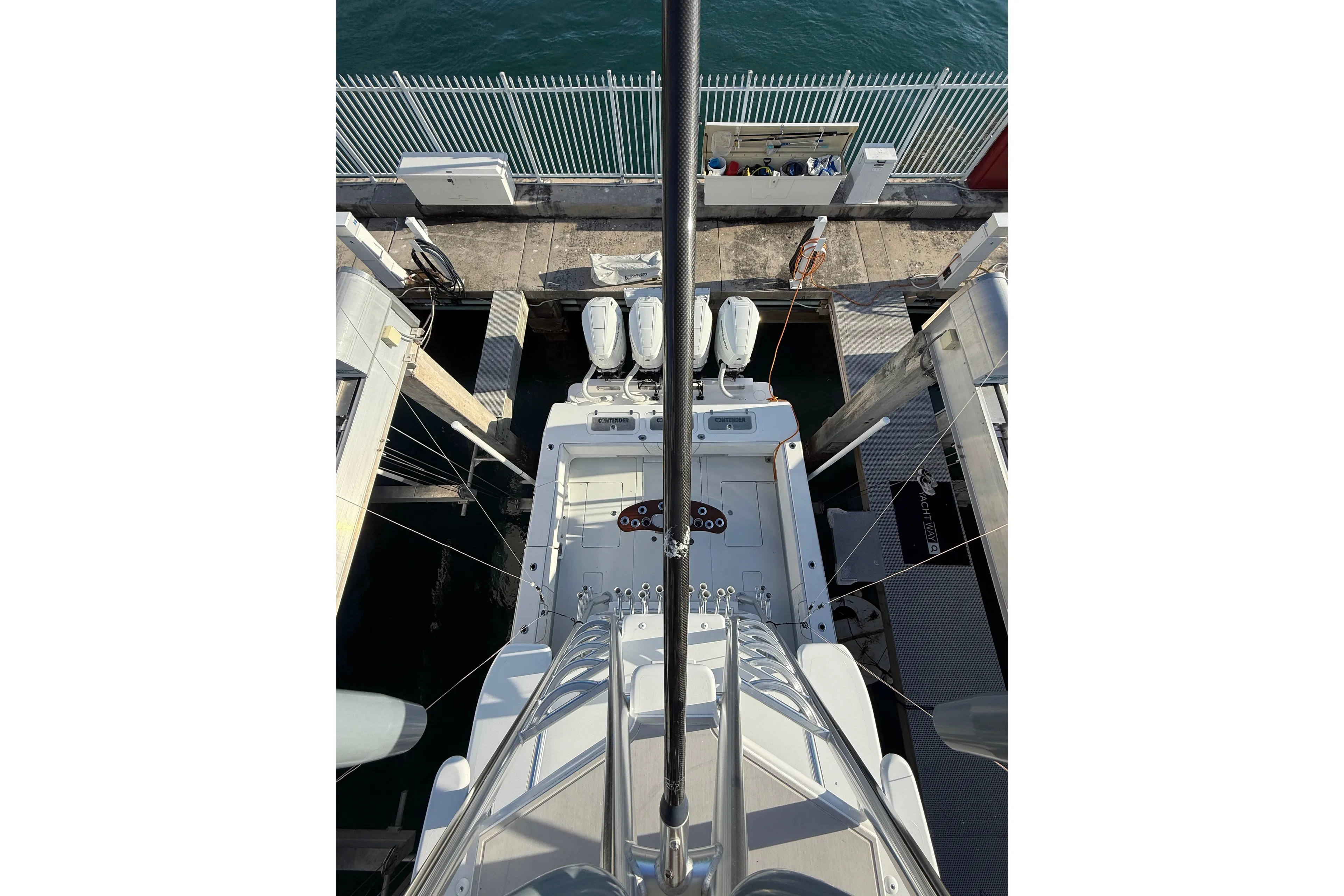 2024 Contender 44 ST boat docked, aerial view showing deck and engines.