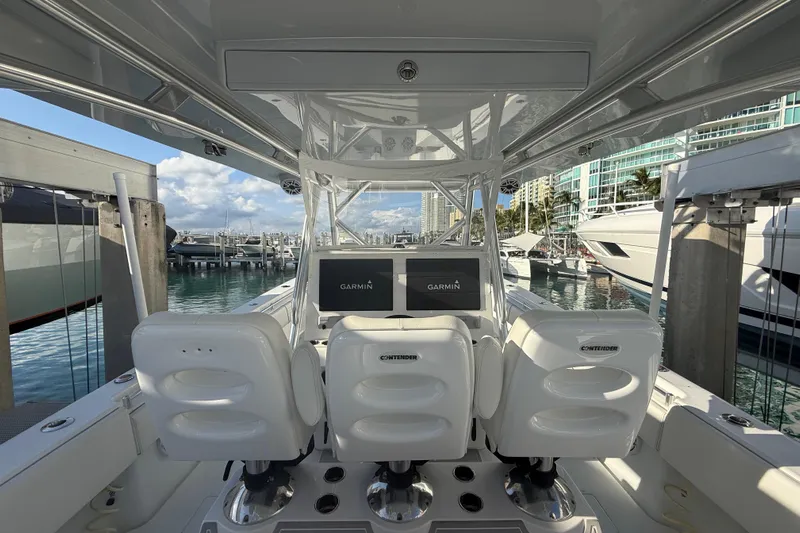 Scott Free Yacht Photos Pics 2024 Contender 44 ST boat interior with Garmin displays at marina.