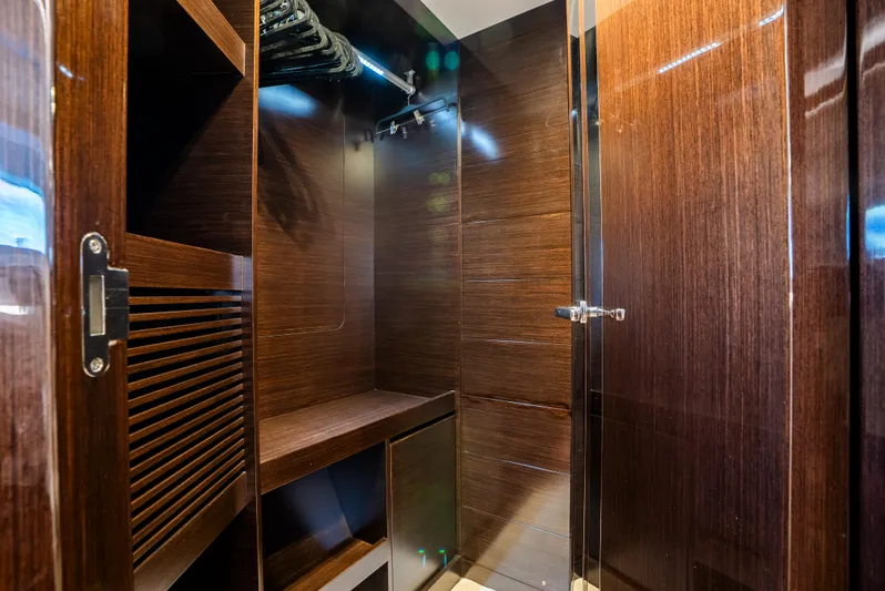 Omnia Yacht Photos Pics Luxurious wooden closet interior on a 2018 Pearl 80 yacht.