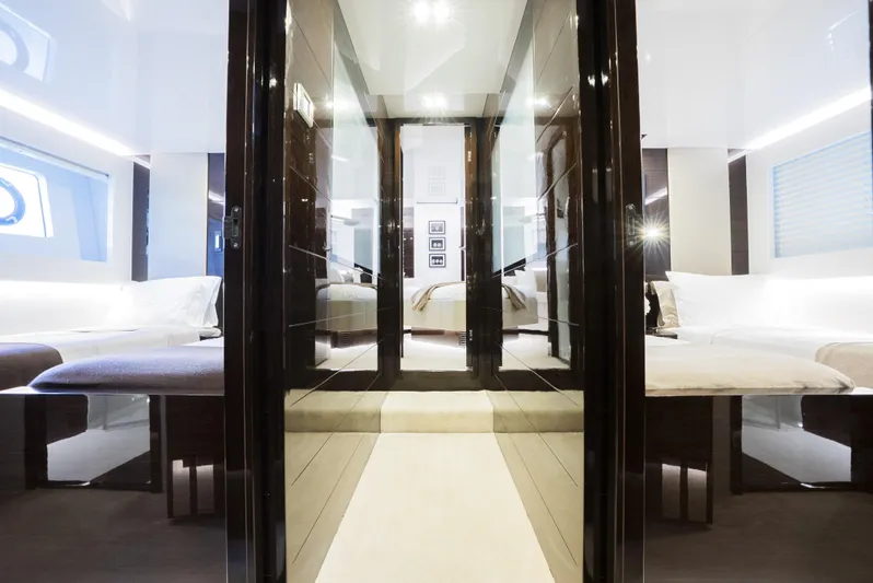 Omnia Yacht Photos Pics Luxurious interior of 2018 Pearl 80 yacht, featuring modern design and comfortable twin beds.