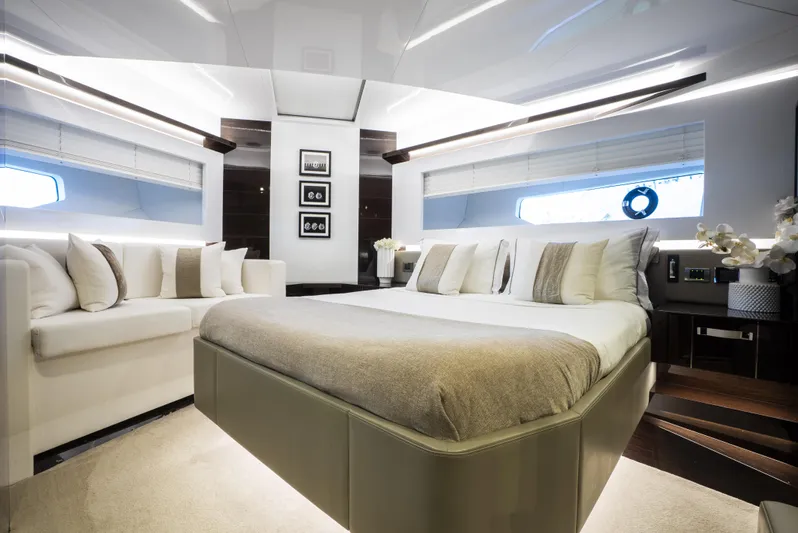 Omnia Yacht Photos Pics Luxurious bedroom interior of 2018 Pearl 80 yacht with modern decor and elegant furnishings.