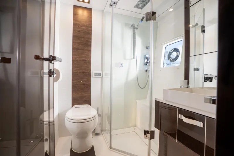 Omnia Yacht Photos Pics Luxurious yacht bathroom with modern fixtures, glass shower, and sleek design, Pearl 80, 2018 model.