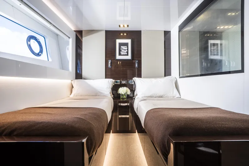 Omnia Yacht Photos Pics Luxurious twin bedroom on 2018 Pearl 80 yacht with modern decor and elegant lighting.