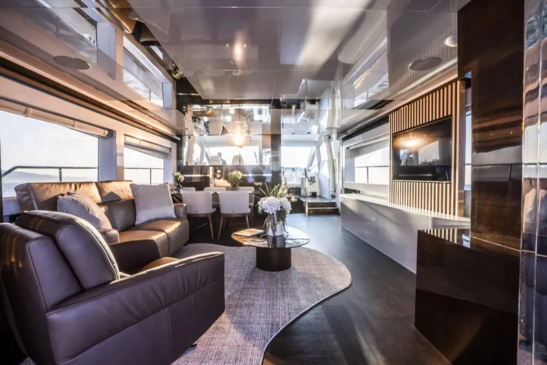 Omnia Yacht Photos Pics Luxurious interior of 2018 Pearl 80 yacht with modern furnishings and elegant decor.