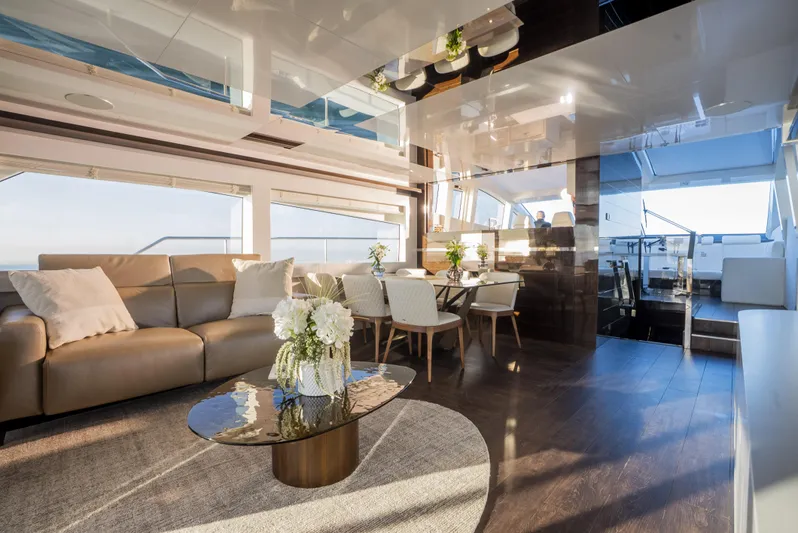 Omnia Yacht Photos Pics Luxurious interior of 2018 Pearl 80 yacht with modern furnishings and elegant decor.