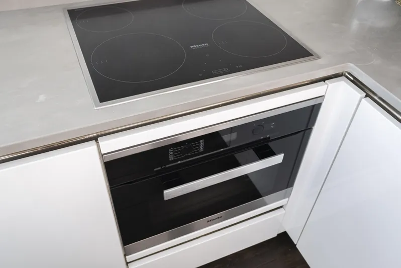 Omnia Yacht Photos Pics Modern kitchen with Pearl 80 induction cooktop and built-in oven, 2018 model.