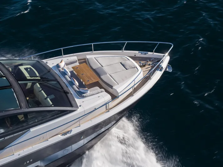 Omnia Yacht Photos Pics Luxurious 2018 Pearl 80 yacht cruising on open water, featuring sleek design and spacious deck.