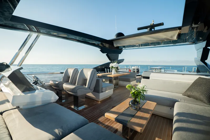 Omnia Yacht Photos Pics Luxurious 2018 Pearl 80 yacht interior with elegant seating and ocean view.