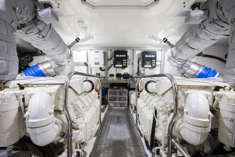 Omnia Yacht Photos Pics Engine room of a 2018 Pearl 80 yacht, featuring dual MAN engines and advanced equipment.