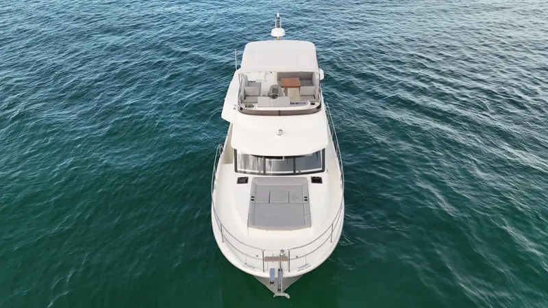 Sarandipity Yacht Photos Pics 2024 Beneteau Swift Trawler 41 Fly on open water, aerial view.