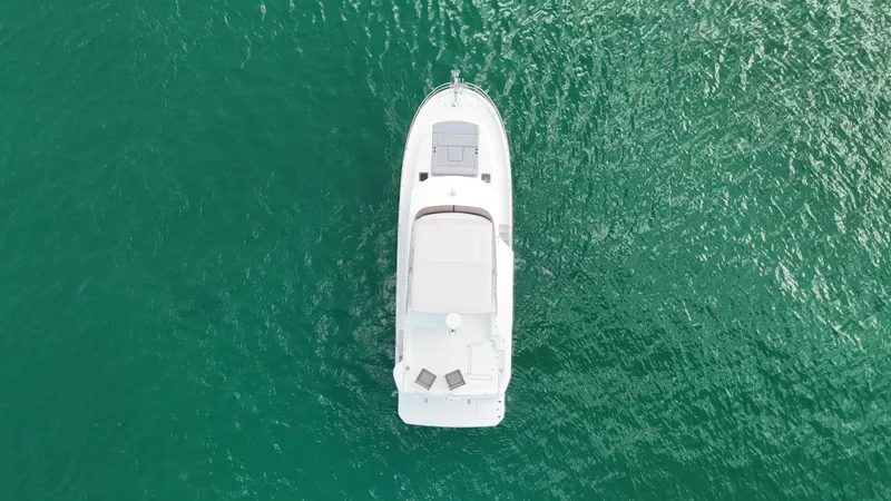 Sarandipity Yacht Photos Pics Aerial view of 2024 Beneteau Swift Trawler 41 Fly on turquoise water.