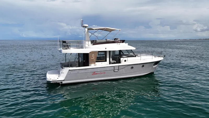 Sarandipity Yacht Photos Pics 2024 Beneteau Swift Trawler 41 Fly on calm ocean waters.
