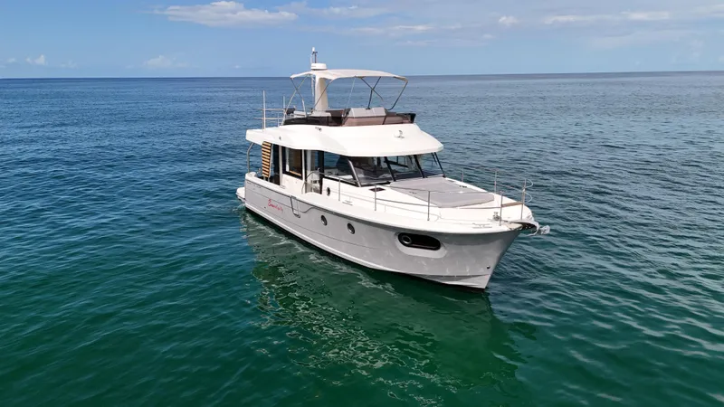 Sarandipity Yacht Photos Pics 2024 Beneteau Swift Trawler 41 Fly cruising on calm ocean waters.