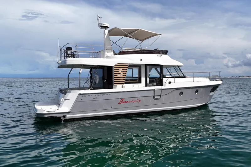 Sarandipity Yacht Photos Pics 2024 Beneteau Swift Trawler 41 Fly on calm water, showcasing sleek design and modern features.