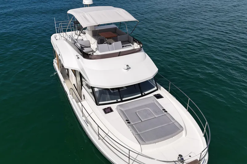 Sarandipity Yacht Photos Pics 2024 Beneteau Swift Trawler 41 Fly cruising on open water, aerial view.