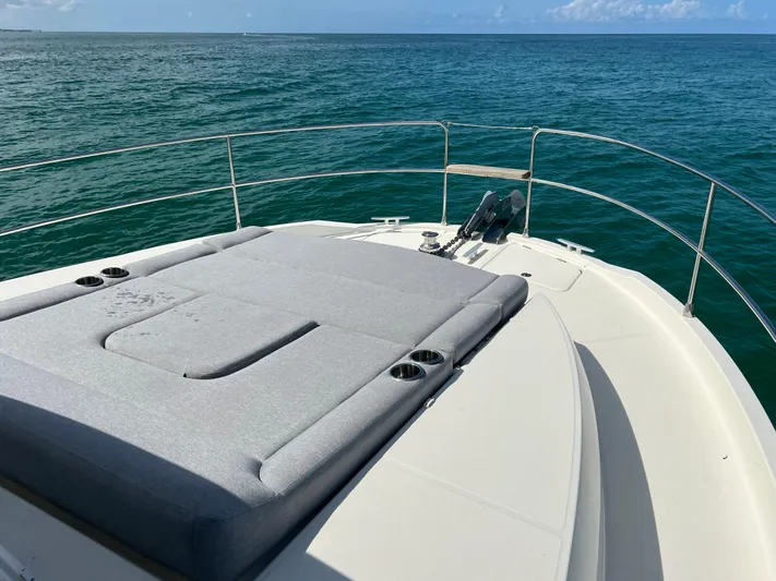 Sarandipity Yacht Photos Pics 2024 Beneteau Swift Trawler 41 Fly deck with sunbed, overlooking the ocean.