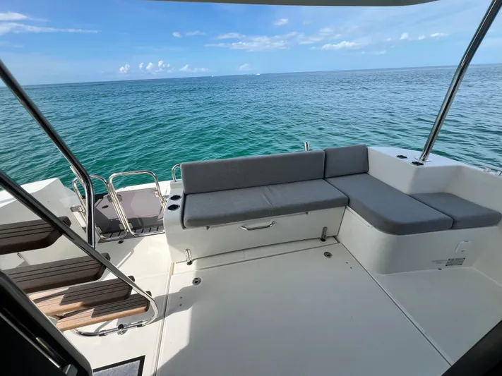 Sarandipity Yacht Photos Pics 2024 Beneteau Swift Trawler 41 Fly deck with ocean view and seating area.