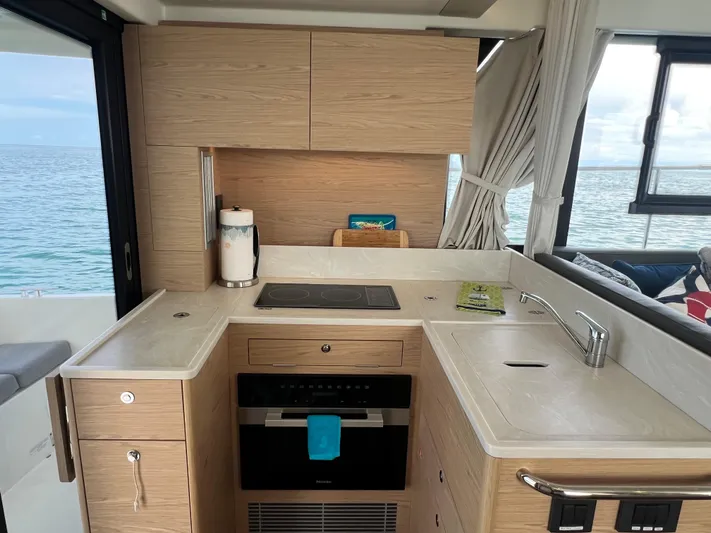 Sarandipity Yacht Photos Pics Interior of 2024 Beneteau Swift Trawler 41 Fly, featuring modern kitchen with ocean view.
