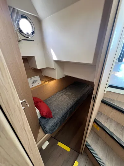 Sarandipity Yacht Photos Pics 2024 Beneteau Swift Trawler 41 Fly cabin interior with bed and porthole.