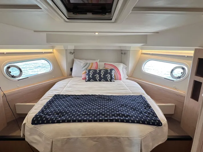 Sarandipity Yacht Photos Pics Luxurious cabin interior of 2024 Beneteau Swift Trawler 41 Fly with cozy bedding.