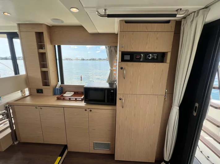 Sarandipity Yacht Photos Pics Interior of 2024 Beneteau Swift Trawler 41 Fly, featuring modern cabinetry and appliances.