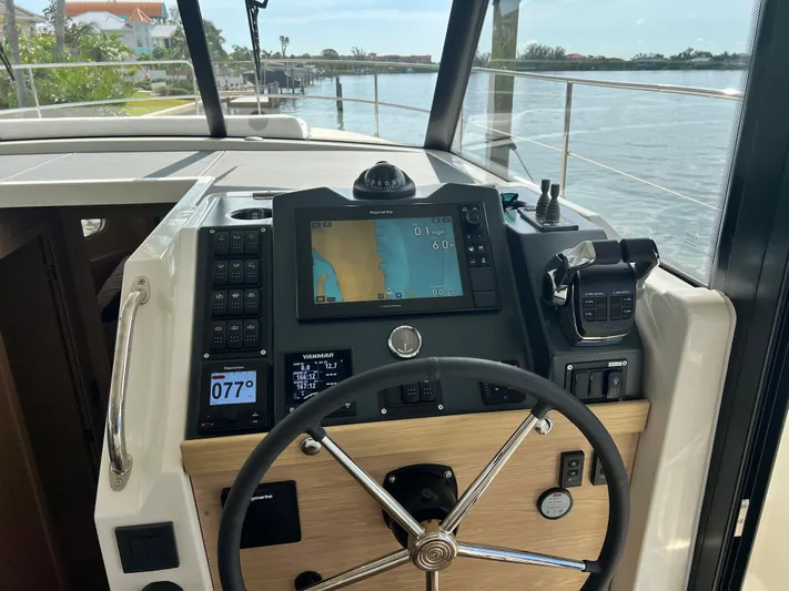 Sarandipity Yacht Photos Pics 2024 Beneteau Swift Trawler 41 Fly helm with navigation display and controls.