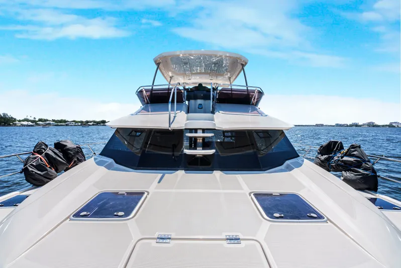 Ryan's Inheritance Yacht Photos Pics 2017 Aquila 44 Yacht on open water under clear blue sky.