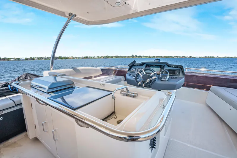 Ryan's Inheritance Yacht Photos Pics 2017 Aquila 44 Yacht helm with modern controls and ocean view.