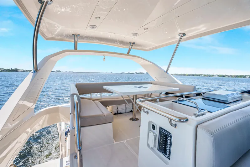 Ryan's Inheritance Yacht Photos Pics Aquila 44 Yacht 2017, spacious deck with seating, cruising on open water.