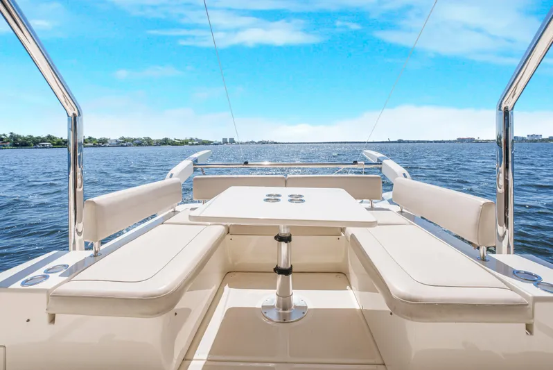 Ryan's Inheritance Yacht Photos Pics Aquila 44 Yacht 2017, spacious deck with seating, overlooking serene blue waters.