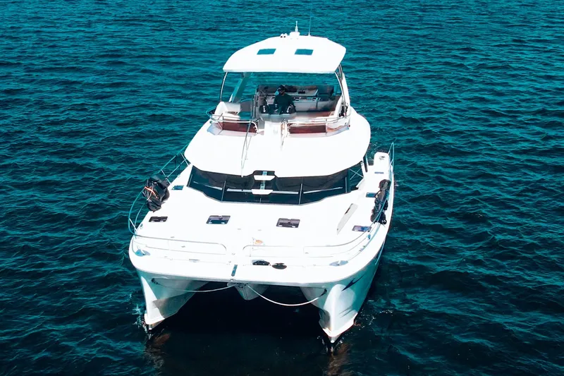Ryan's Inheritance Yacht Photos Pics 2017 Aquila 44 Yacht on open water, showcasing sleek design and spacious deck.