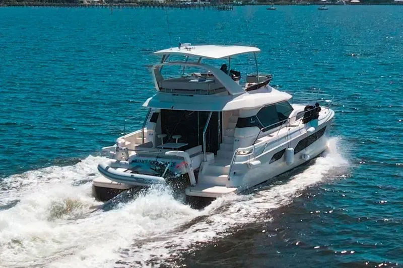 Ryan's Inheritance Yacht Photos Pics Aquila 44 Yacht cruising on blue water, 2017 model.