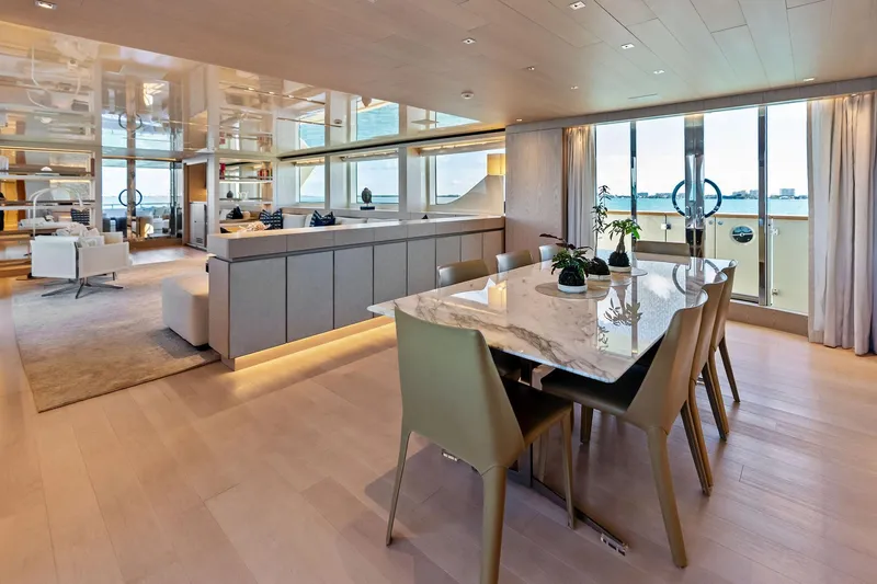 Glory Yacht Photos Pics Luxurious interior of 2023 Sanlorenzo SD126 yacht with elegant dining area and panoramic views.