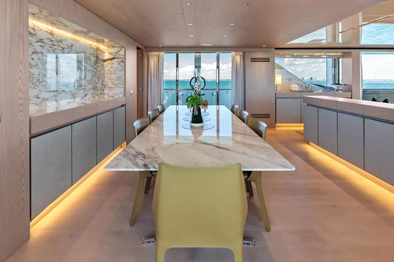 Glory Yacht Photos Pics Luxurious dining area on 2023 Sanlorenzo SD126 yacht with marble table and ocean view.