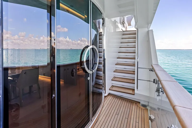 Glory Yacht Photos Pics Luxurious 2023 Sanlorenzo SD126 yacht deck with ocean view and elegant staircase.