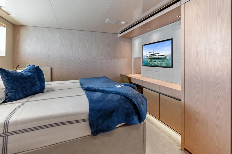 Glory Yacht Photos Pics Luxurious Sanlorenzo SD126 2023 yacht bedroom with modern decor and wall-mounted TV.