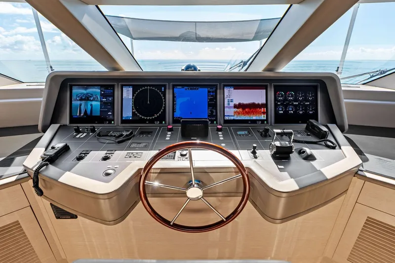 Glory Yacht Photos Pics Control panel of 2023 Sanlorenzo SD126 yacht with advanced navigation displays and steering wheel.